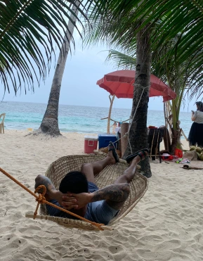 Picture of me on a hammock on beach in the Philippines